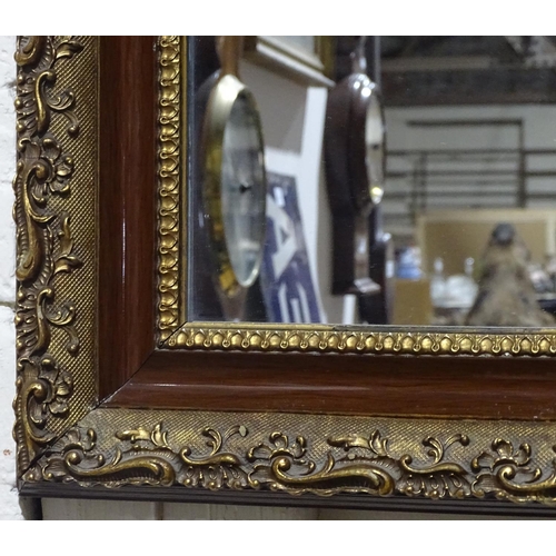 376 - An ornate gilt-framed wall mirror, height 40