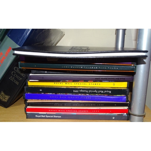 384 - First Day Cover albums, and various Royal Mail special stamps issues with books