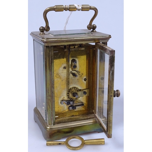 394 - A brass carriage clock retailed by Rodrigues Piccadilly, 4.5