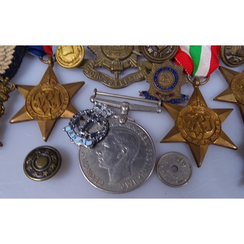 399 - Second World War medals, Regimental badges etc