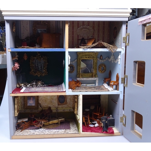 41 - A modern doll's house fitted with various furniture, rugs and accessories, height 23