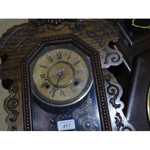 417 - A carved oak-cased wall clock, 23