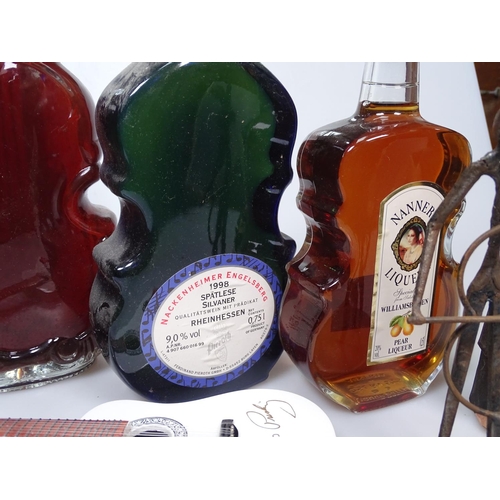 46 - Austrian liqueur in a violin-shaped bottle, wine, a carved wood figure etc