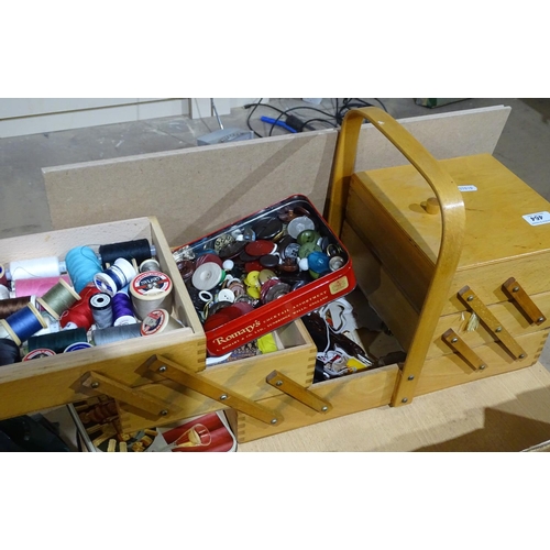 464 - A cantilever sewing box and contents, and a tin of buttons