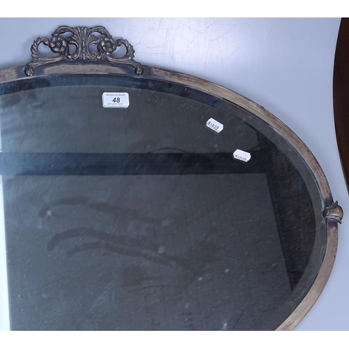 48 - A wall mirror in ornate carved giltwood frame, height 24.5