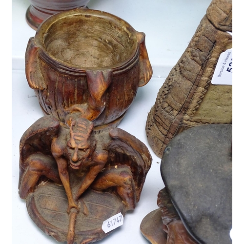 523 - A Satan figure, a tobacco jar and another, and a stoneware decanter