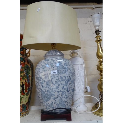 586 - An Oriental table lamp and shade, 30