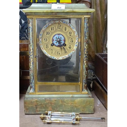 66 - An onyx-cased clock with enamelled brass mounts, height 13.25