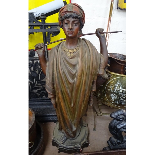 67 - A Vintage painted and gilded plaster Eastern robed figure on plinth, height 26.5