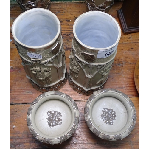 685 - A pair of German silvered stoneware vases, and a pair of similar tazzas