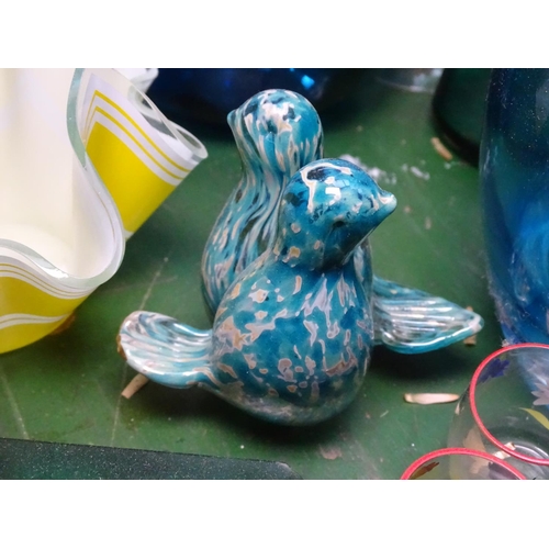 707 - A blue Art glass jug, 7.5