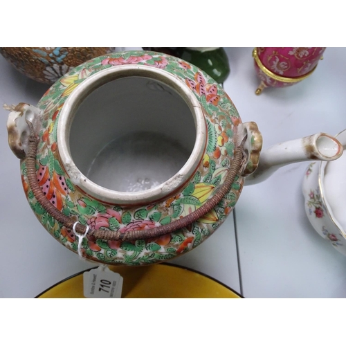 710 - A Canton teapot, and a Doulton series plate