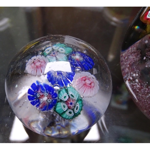 733 - 2 similar floral design paperweights, largest 3.25