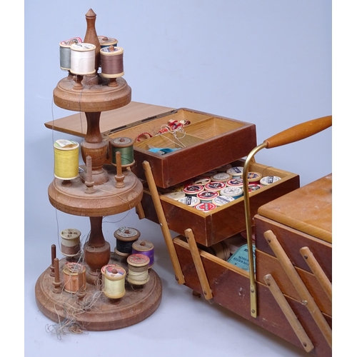 8 - A cantilever sewing box and contents, and a cotton reel stand