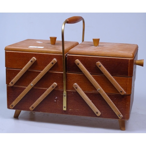 8 - A cantilever sewing box and contents, and a cotton reel stand