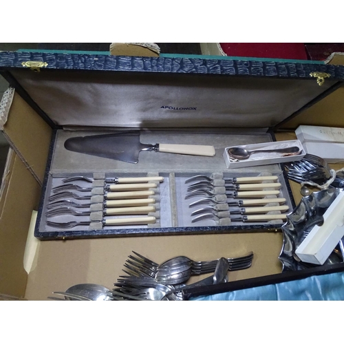 802 - A box of mixed plated cutlery, oval tea tray etc