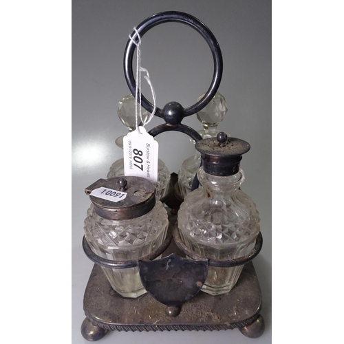 807 - A silver plated 4-bottle condiment set on stand