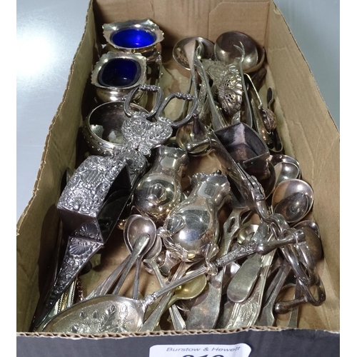 819 - A box containing silver plated candle snuffers, cruets, and cutlery etc