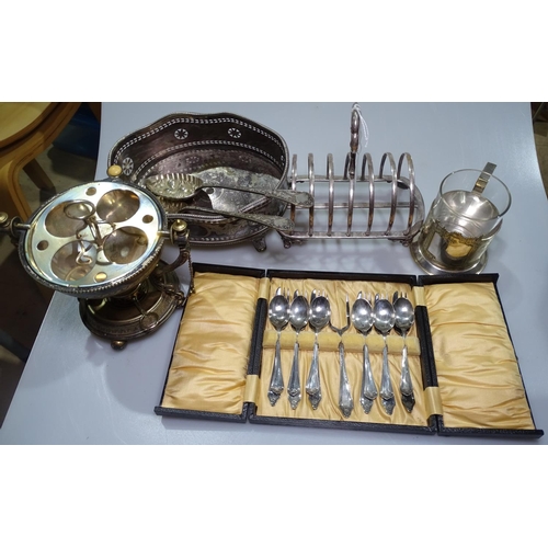 830 - A silver plated egg coddler, a toast rack, berry spoons etc