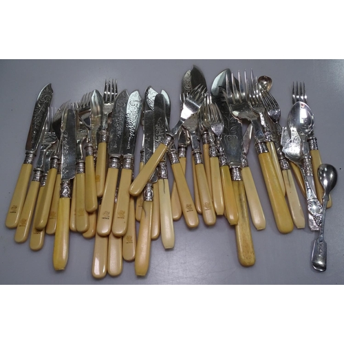 849 - A suite of engraved silver plated and ivorine handled fish cutlery for 12 people, with silver collar... 