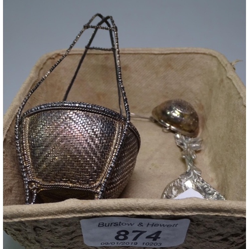 874 - A silver tea caddy spoon, and a silver tea infuser, and an Oriental white metal basket