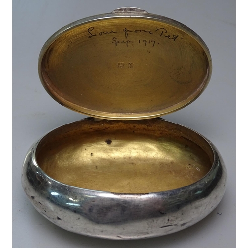 894 - An oval silver tobacco box by William Neale, Birmingham 1915