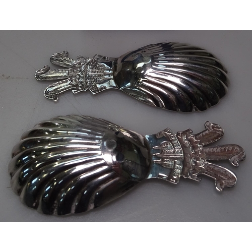 899 - A pair of modern silver tea caddy spoons, decorated with the Prince of Wales feathers