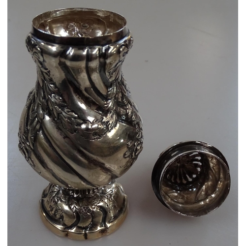 902 - A German silver sugar caster, with floral embossed decoration, maker's marks to base, height 14cm