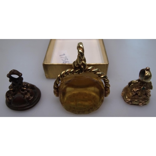 909 - A Victorian unmarked gold swivel seal, with engraved decoration, and 2 other Victorian gilt-metal se... 