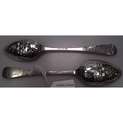 914 - A pair of Victorian engraved and embossed silver table spoons, hallmarks for Sheffield 1885, 3.8oz