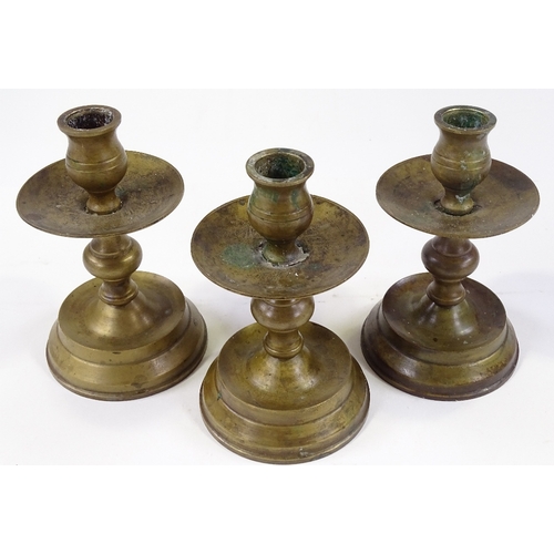 85 - A set of bronze candle stands, height 14cm