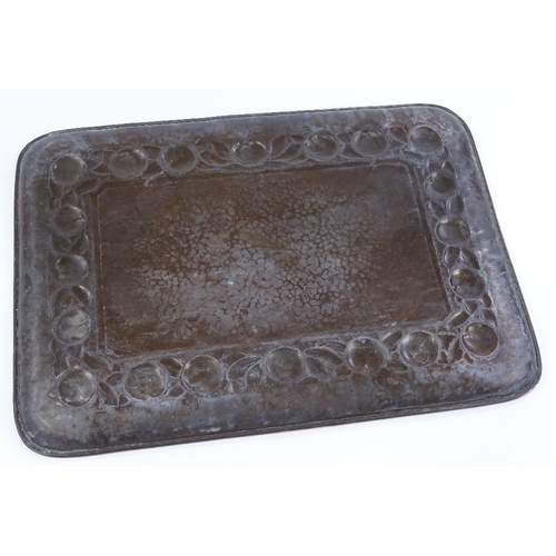 1 - A Newlyn Arts and Crafts rectangular copper tray, with relief embossed fruit decorated border, 45cm ... 