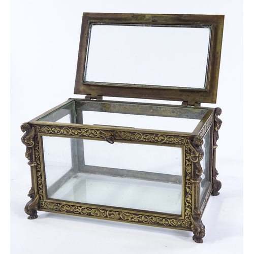 145 - A Victorian cast-brass framed casket, with relief moulded decoration and glass panels, width 22cm