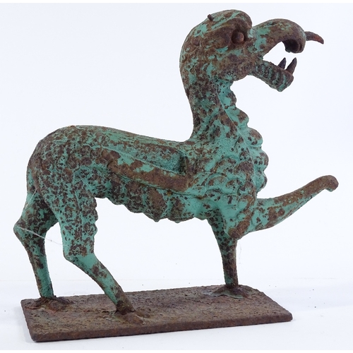 146 - A verdigris cast-iron ornamental dragon, length 24cm, height 24cm