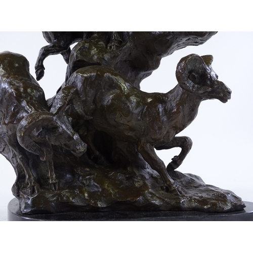 147 - A patinated bronze sculpture depicting mountain goats on a rocky outcrop, black marble plinth, indis... 