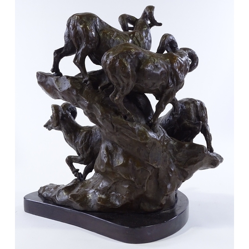 147 - A patinated bronze sculpture depicting mountain goats on a rocky outcrop, black marble plinth, indis... 