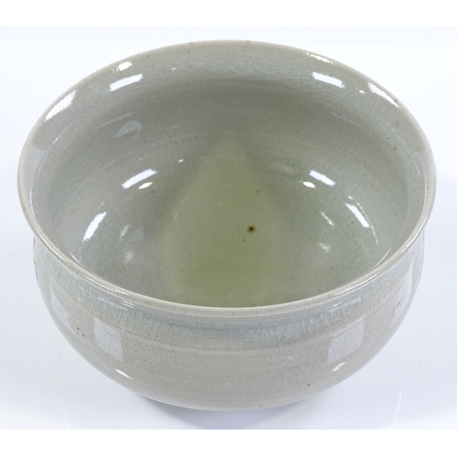 149 - A Chinese celadon glaze porcelain bowl, with flashes of iron red colour, diameter 13cm