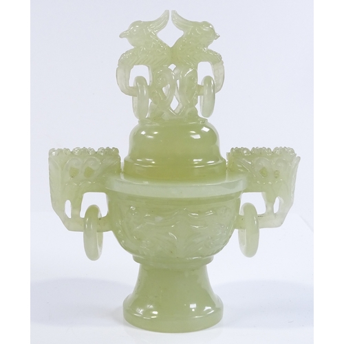 153 - A Chinese carved jade incense burner and cover, with dragon decorated ring handles, height 17cm