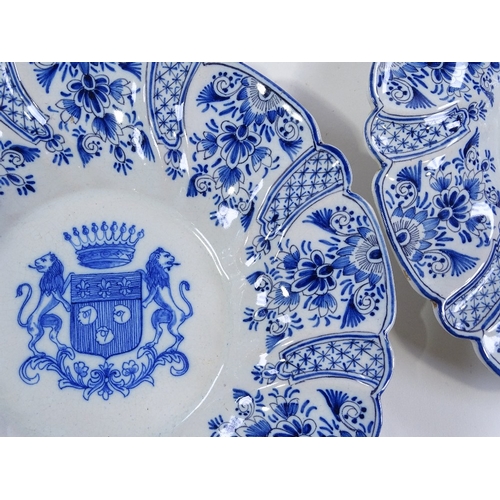 154 - A pair of Delft tin-glazed pottery plates, with moulded surrounds and armorial centres, diameter 27c... 