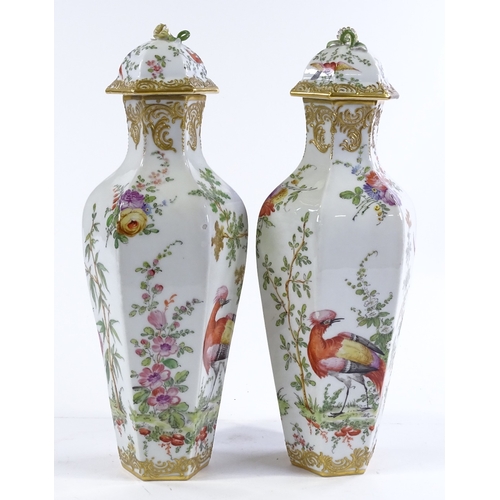 155 - A pair of porcelain vases and covers, circa 1900, hand painted exotic birds and flowers, with gold a... 