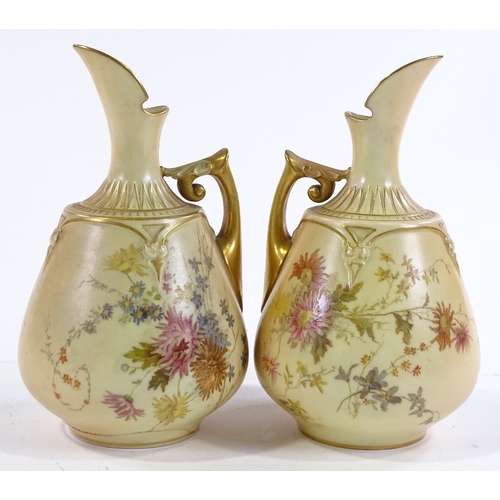 159 - A pair of Royal Worcester ewers with painted floral and gilded decoration, pattern no. 1668, registe... 