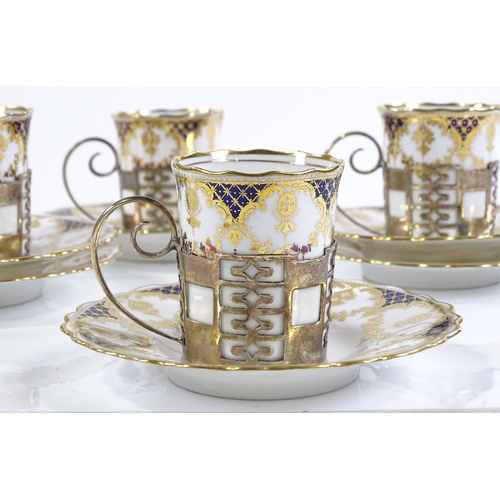 160 - A set of 4 Aynsley gilded china coffee cups and saucers, in silver holders