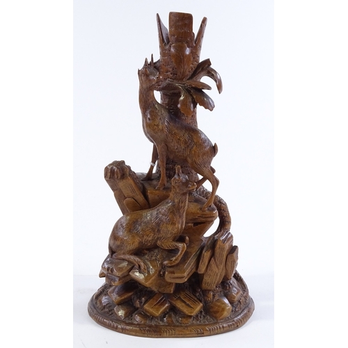 163 - A 19th century Black Forest carved wood vase, with mountain goat designs, height 27cm