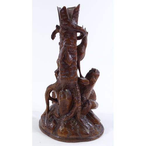 163 - A 19th century Black Forest carved wood vase, with mountain goat designs, height 27cm