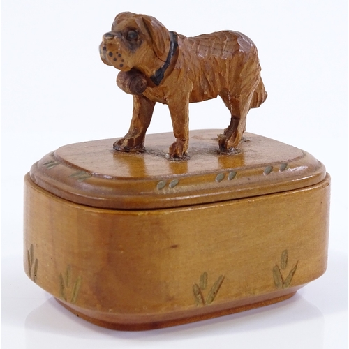 185 - A small Black Forest carved wood box surmounted by a dog, length 6cm