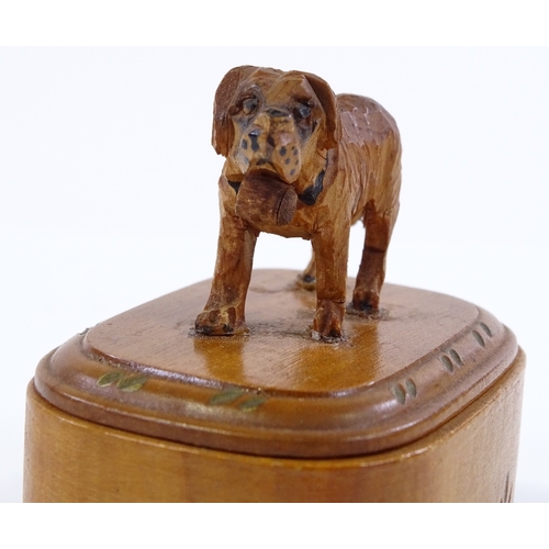 185 - A small Black Forest carved wood box surmounted by a dog, length 6cm