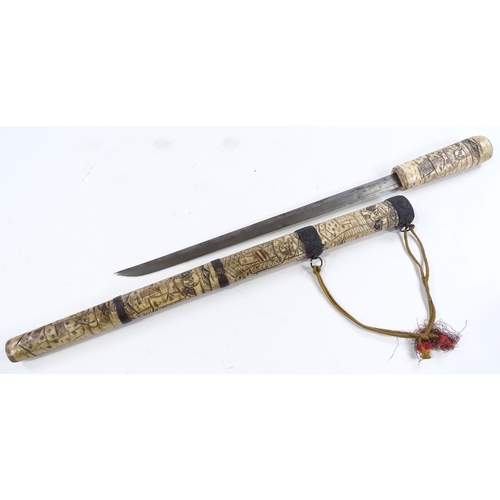 186 - A Japanese carved bone sword, circa 1900, overall length 60cm