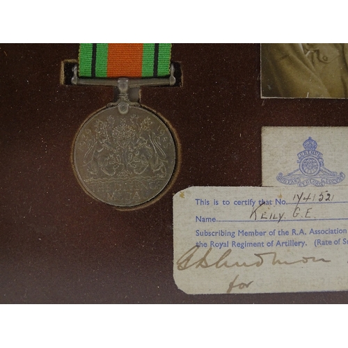 189 - A framed pair of Second War Service medals, awarded to 1741521 Gnr G E Keily RA