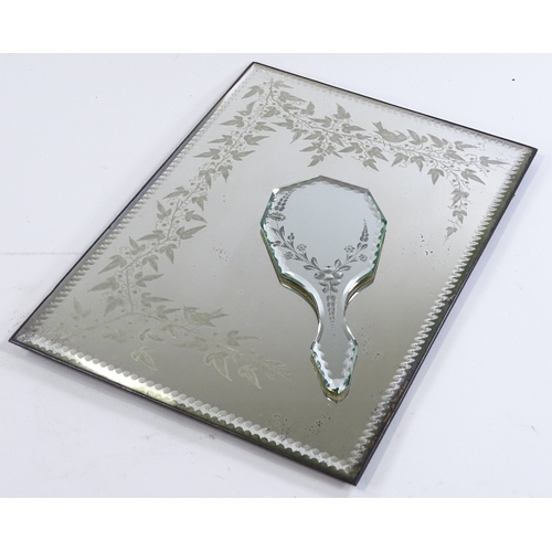 198 - A Victorian wall mirror with etched vine decoration, 46cm x 33cm, and a similar hand mirror (2)