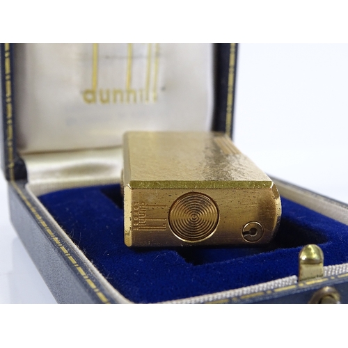 62 - A Dunhill gold plated pocket lighter, boxed